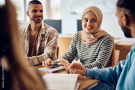 happy muslim student talks   classmates  learning