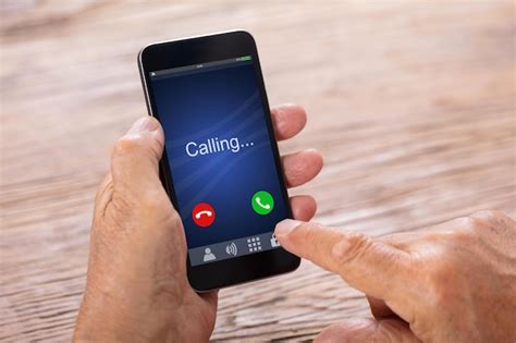 Premium Photo | Man Holding Smartphone With Incoming Call