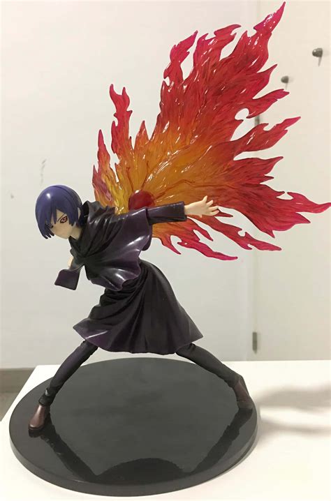 Download Touka Kirishima Strikes A Powerful Pose. Wallpaper