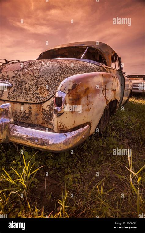 Old rusty car in junkyard Stock Photo - Alamy