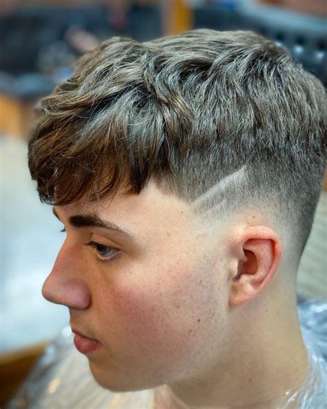 Messy crop with a low fade ‘this is as adventurous I get with line work