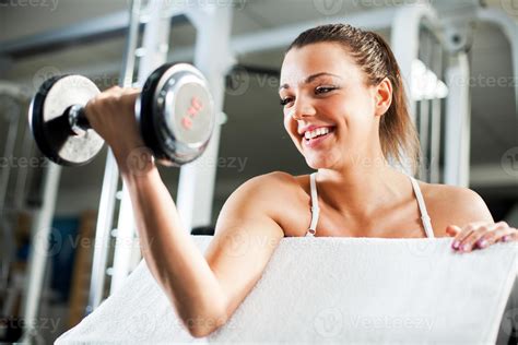 Young Woman Doing Biceps Exercise 14231786 Stock Photo at Vecteezy