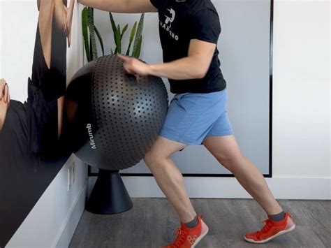 wall ball isometric hip flexion rehab hero