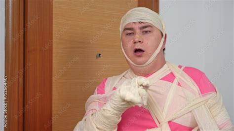 Bad day, exhausted man with broken arm, concussion, covered in bandages ...