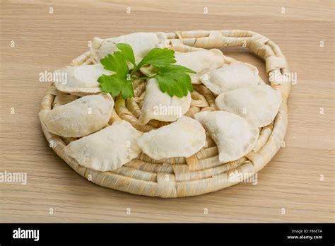 Raw Ukrainian vareniki on the board Stock Photo - Alamy