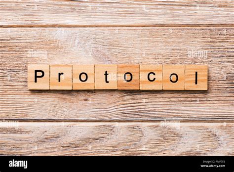 protocol word written  wood block protocol text  wooden table
