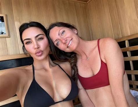 Kim Kardashian sizzles in busty black bikini as she shows off jaw
