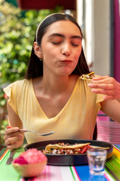 brunette woman eating food  stock photo
