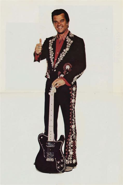 Download Conway Twitty Thumbs Up With Guitar Wallpaper | Wallpapers.com