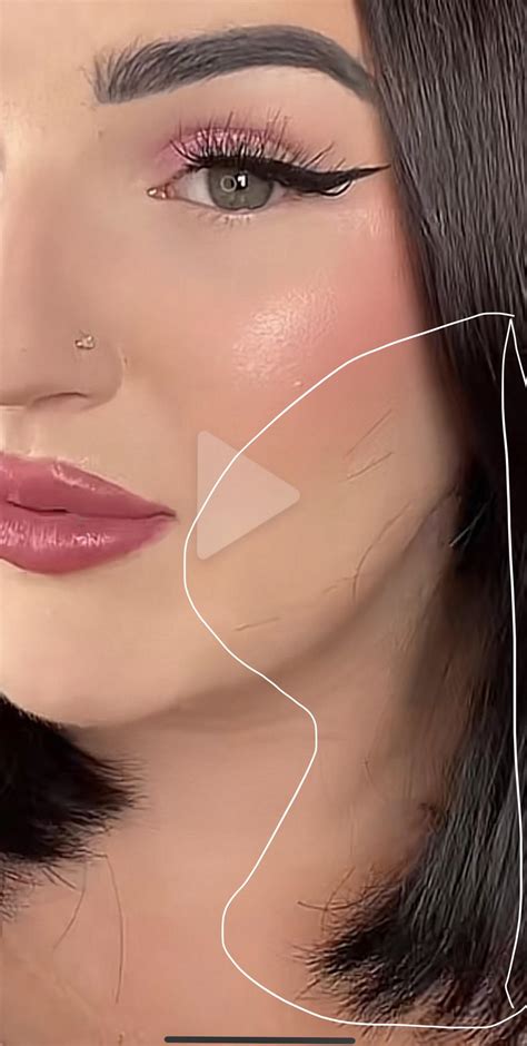 Obvious filter glitch pulling stray hairs into her face, in her newest