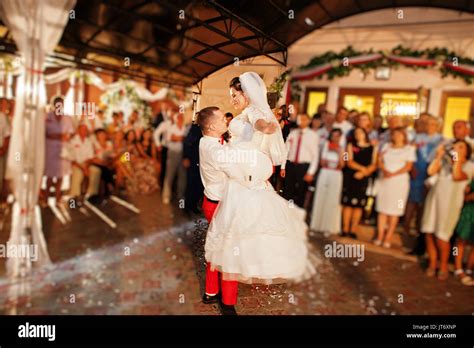 Fantastic wedding couple dancing their first dance in the restaurant ...
