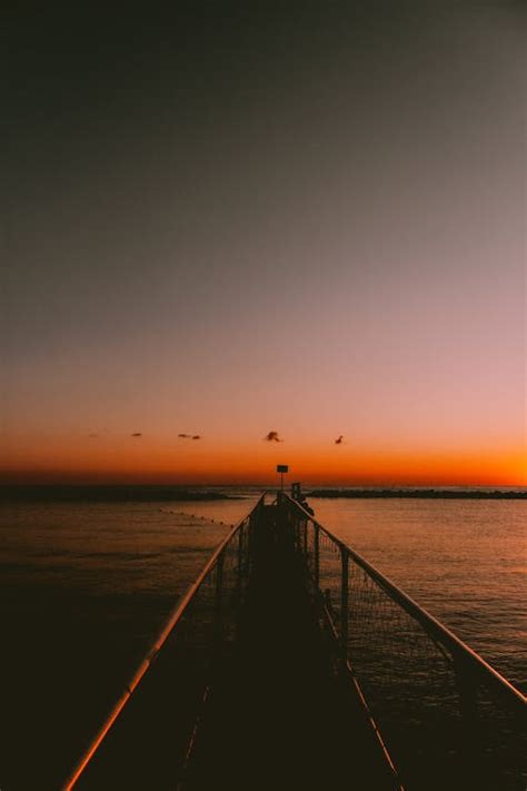 Jetty at Sea During Sunset · Free Stock Photo