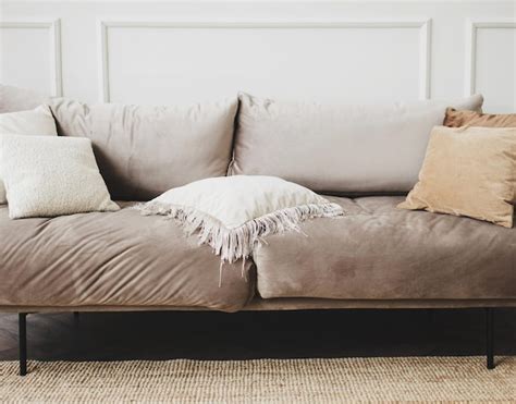 Premium Photo | Gray sofa with pillows