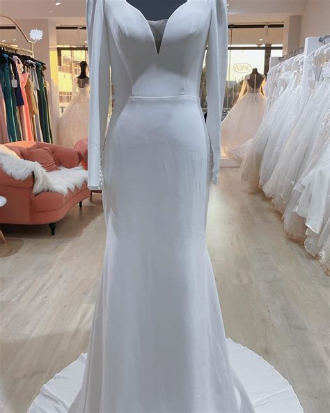 Theressa, Long sleeve low back sheath wedding dress. - www.fayebridal.co.za
