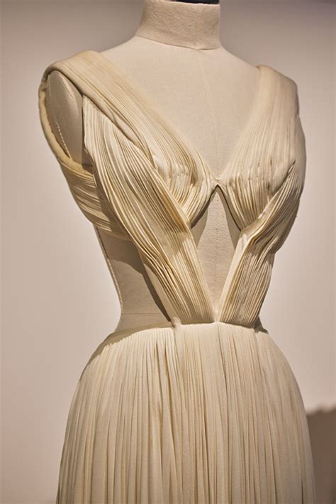 encrusted  pleated arabesque panel wrapping   front circa