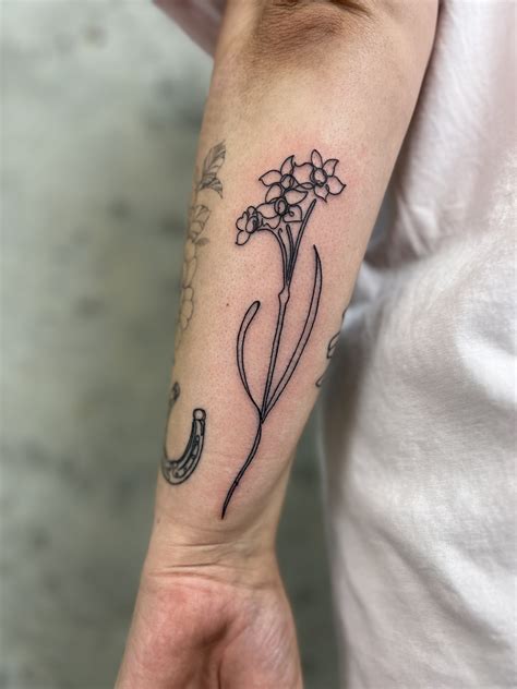 delicate single  flower tattoo tattoodo