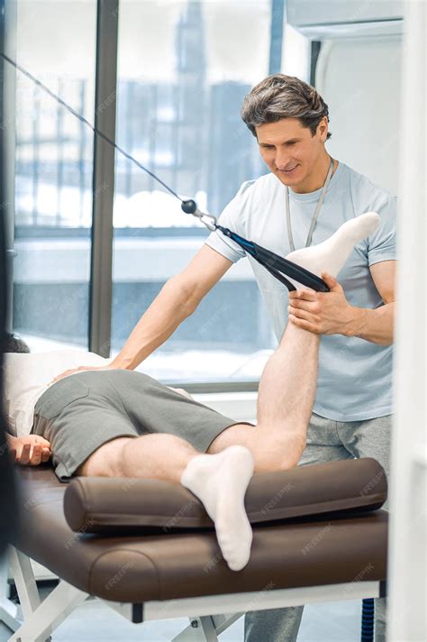 Premium Photo | Hyperextension male patient having a leg hyperextension