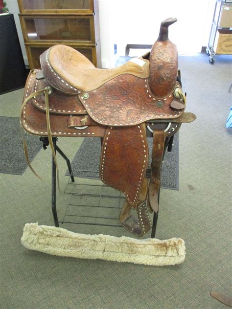 16" Riding Saddle - rawhide covered wood tree - Bodnarus Auctioneering