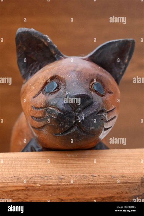 ornamental wooden cat Stock Photo - Alamy
