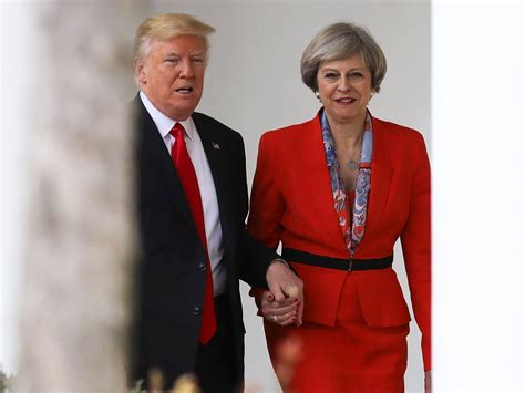 Donald Trump and Theresa May caught holding hands in…
