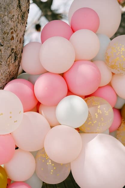 Premium Photo | Closeup of many helium balloons in pastel colors