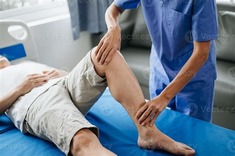 Close up of Physiotherapist working with patient on the bed 22869494