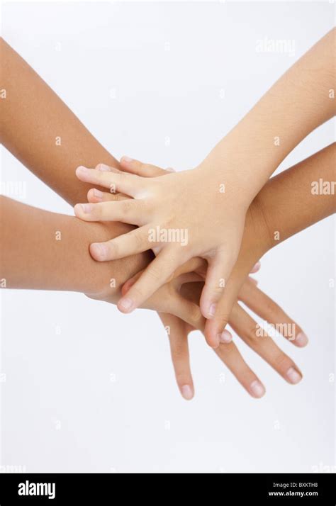 Overlapping hands Stock Photo - Alamy