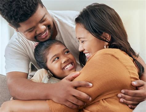 Information Premium Photo | Asian family parents and child hug on sofa bonding love Guide