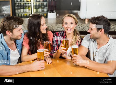 Friends drinking beer Stock Photo - Alamy