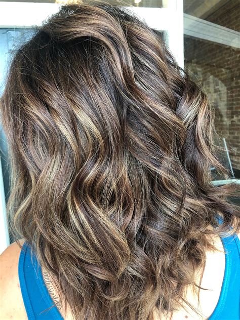 Dimensional tones will define light brown color hair with highlights 26