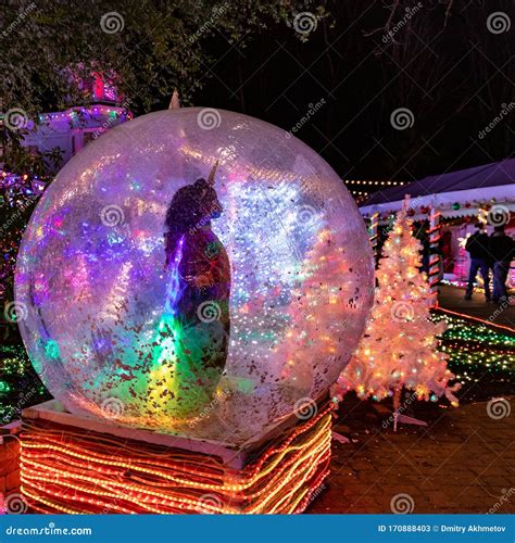 A Girl in a Costume of a Unicorn Dancing Inside a Huge Ball Editorial