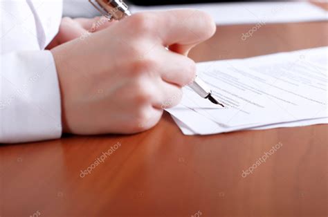 persons hand signing document stock photo  csergeynivens
