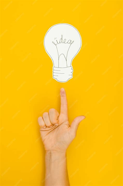 photo hand pointing   lighten bulb