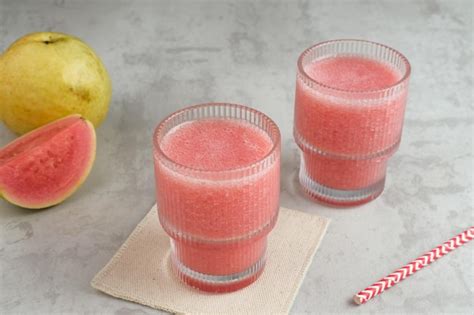 premium photo  glass  nutritious organic pink guava juice