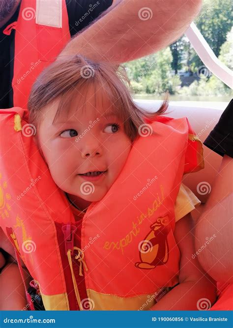 Baby wearing life jacket stock photo. Image of children - 190060856