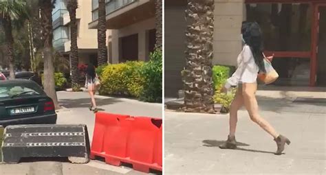 woman arrested  naked protest  busy street