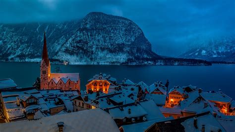 hallstatt winter night snowy mountain village   ultra hd