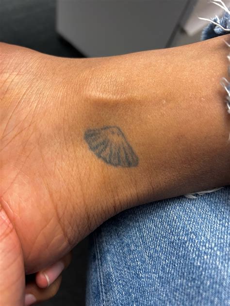 Artists are clashing over the small angel with wings tattoo 4