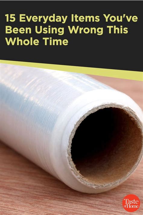 a roll of clear plastic wrap sitting on top of a wooden table with the ...