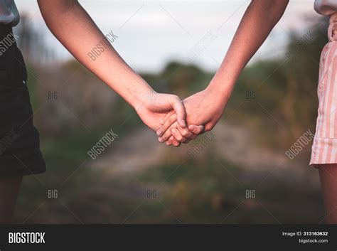 girl  guy holding hands