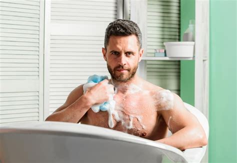 premium photo man handsome muscular guy relaxing  bath skin care
