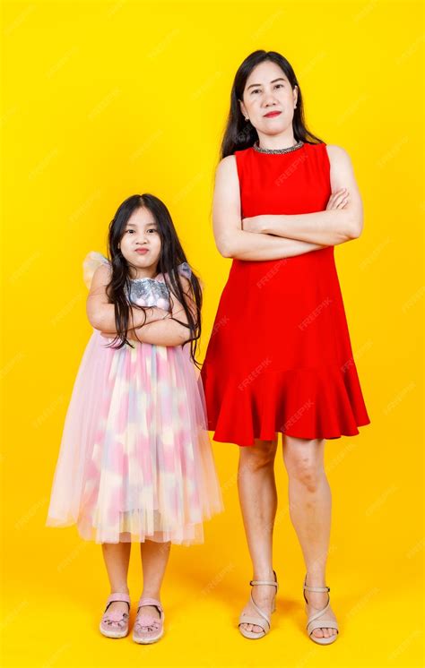 Premium Photo | Asian mom and daughter taking portrait photo together