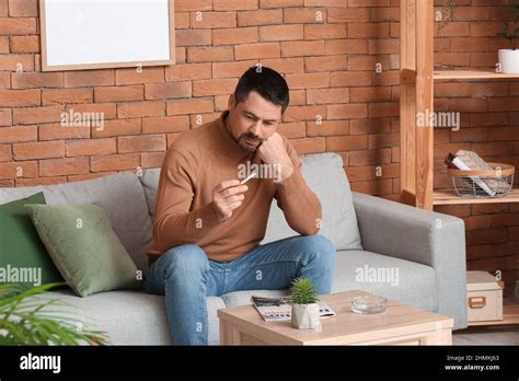 Thoughtful man with cigarette at home. Concept of refusing from bad ...