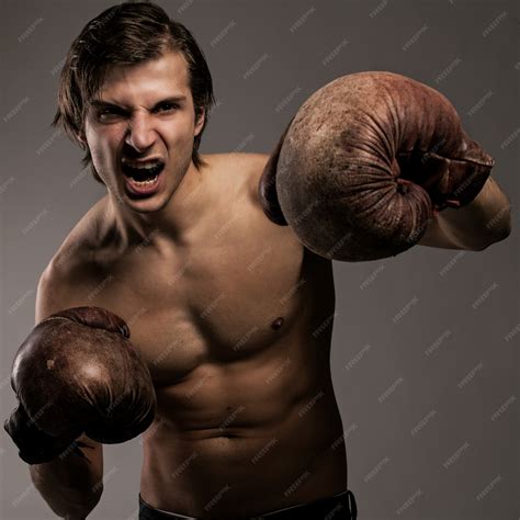 Free Photo | Agressive guy in a boxing gloves