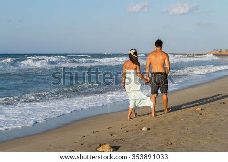 couple naturist sitting  beach  stock photo  shutterstock