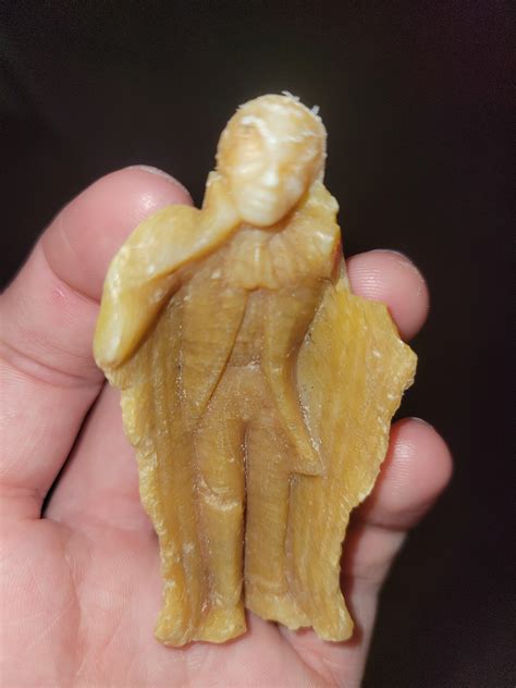 wax or plastic figure found on beach, looks like man with cape : r