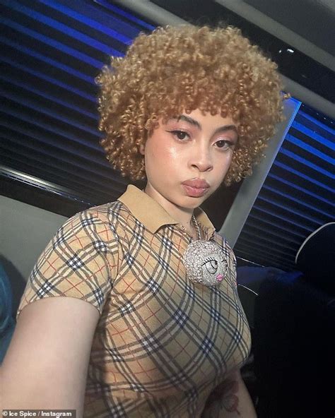 Ice Spice puts on a cheeky display and bares her midriff in a tiny