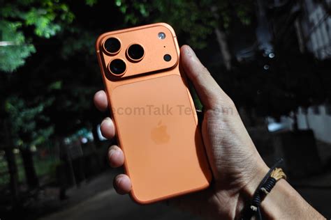 iphone  pro cosmic orange hands