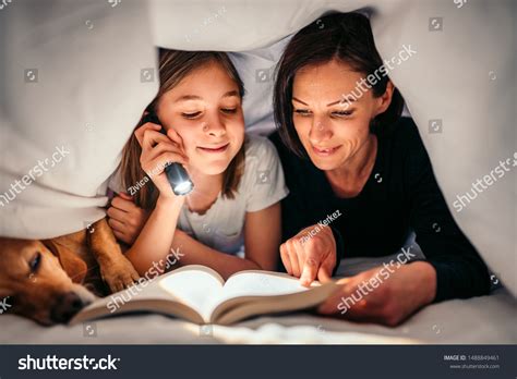 19 Adult reading in the dark under covers Images, Stock Photos ...