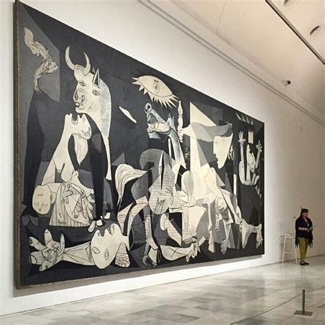 a large black and white painting hanging on the wall in an art gallery ...